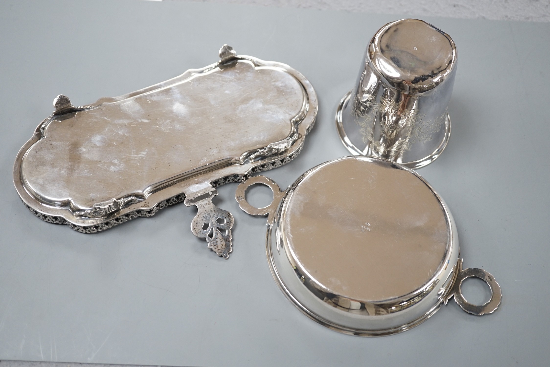 An engraved French white metal beaker, 81mm, a similar two handled shallow bowl by Risler and a modern Italian white metal snuffers stand, gross 13.5oz.